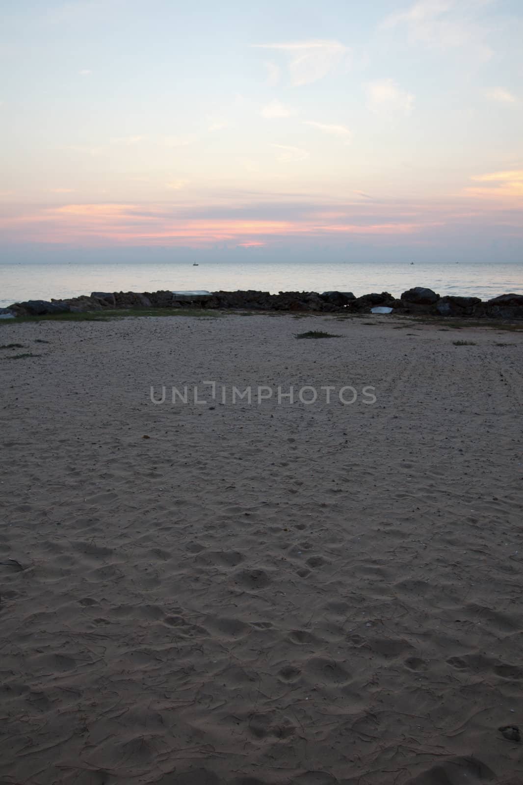 The beach is a beautiful seaside sun goes down