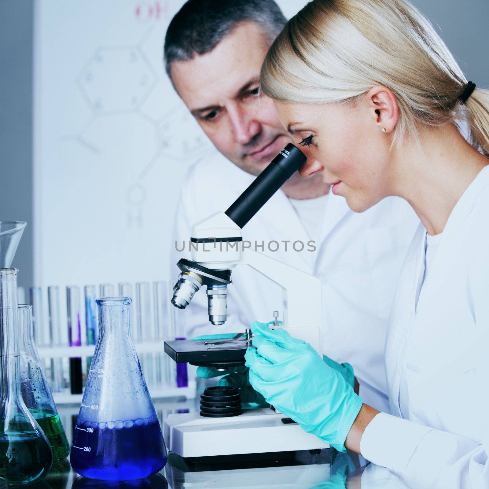  two scientist in chemical lab conducting experiments