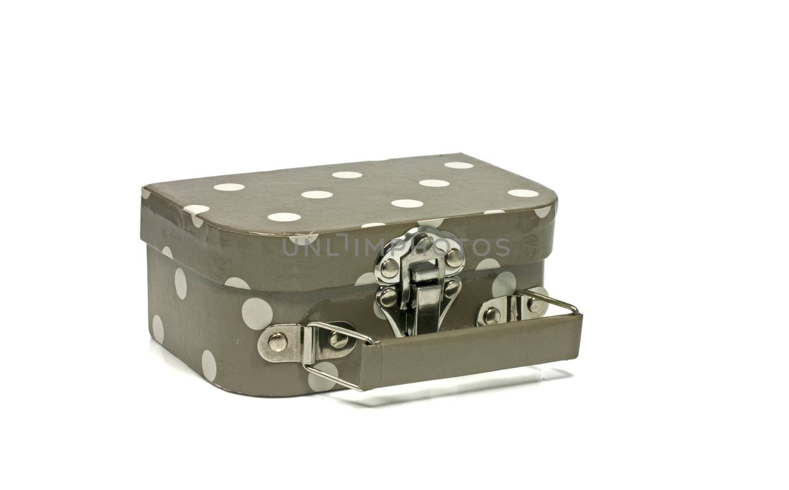brown suitcase with white dots