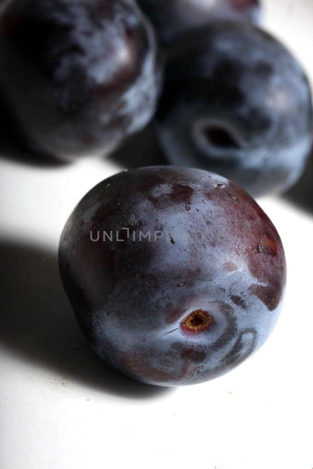 fresh purple plums by Teka77