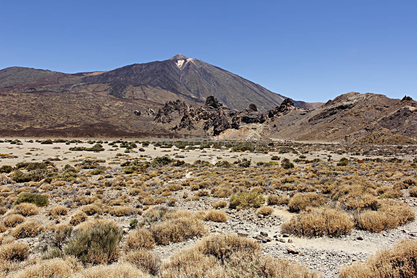 The conical volcano Mount Teide or El Teide in Tenerife is Spains highest mountain. It has featured as the location of many hollywood films and is the premier tourist attraction in the Canary islands