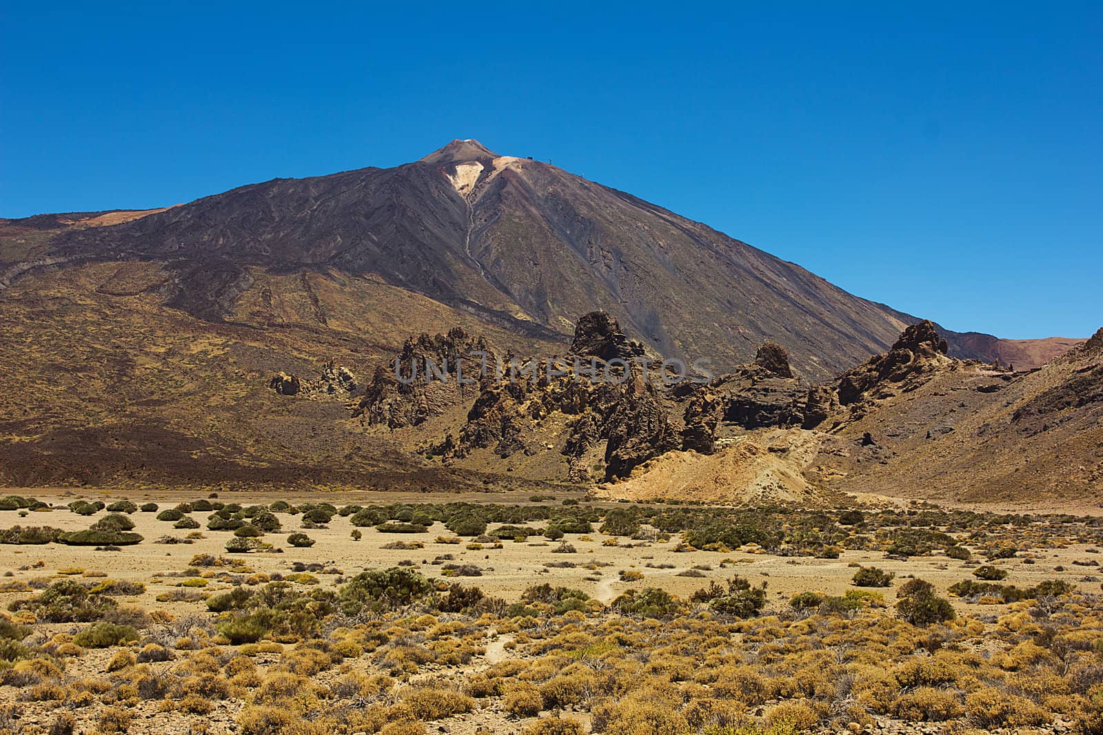 The conical volcano Mount Teide or El Teide in Tenerife is Spains highest mountain. It has featured as the location of many hollywood films and is the premier tourist attraction in the Canary islands 