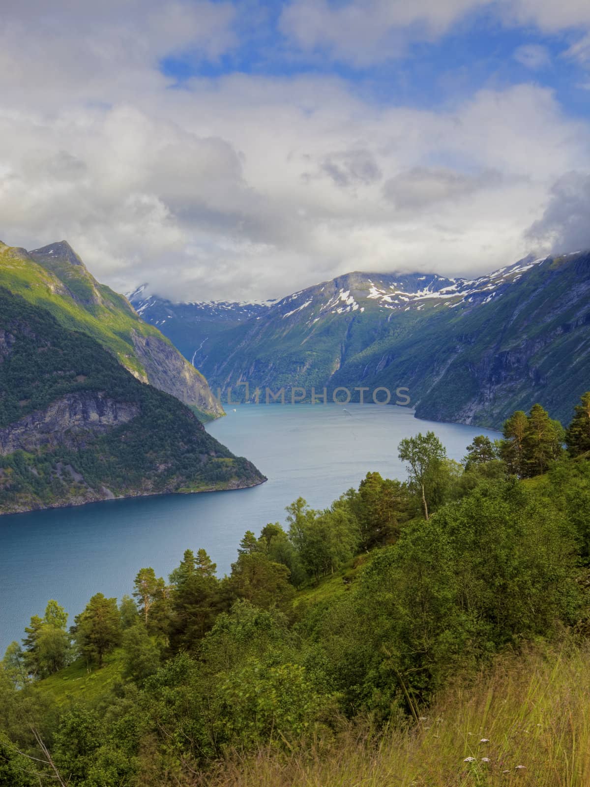 The Geiranger fjord in Norway, surrounded by high mountains