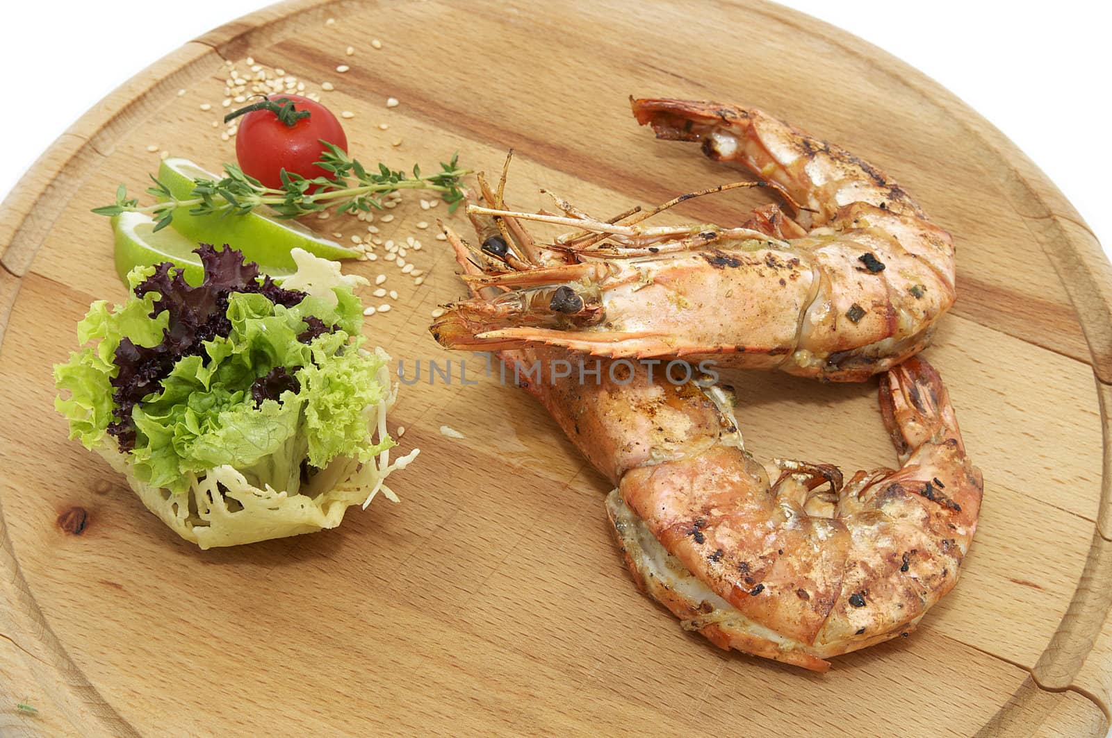 Grilled Shrimp with Orange on a wooden plate