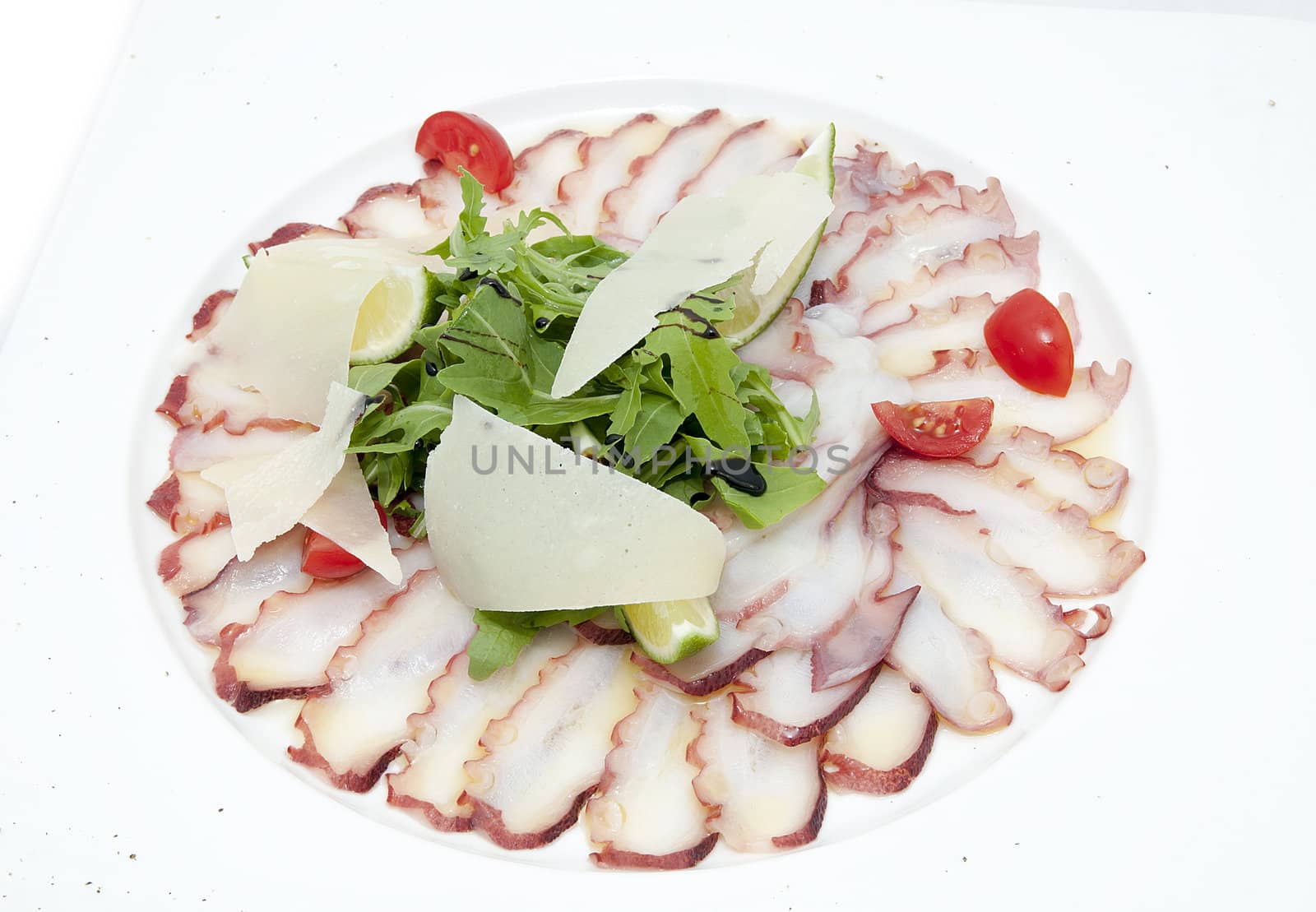 carpaccio of octopus in a restaurant on a white background