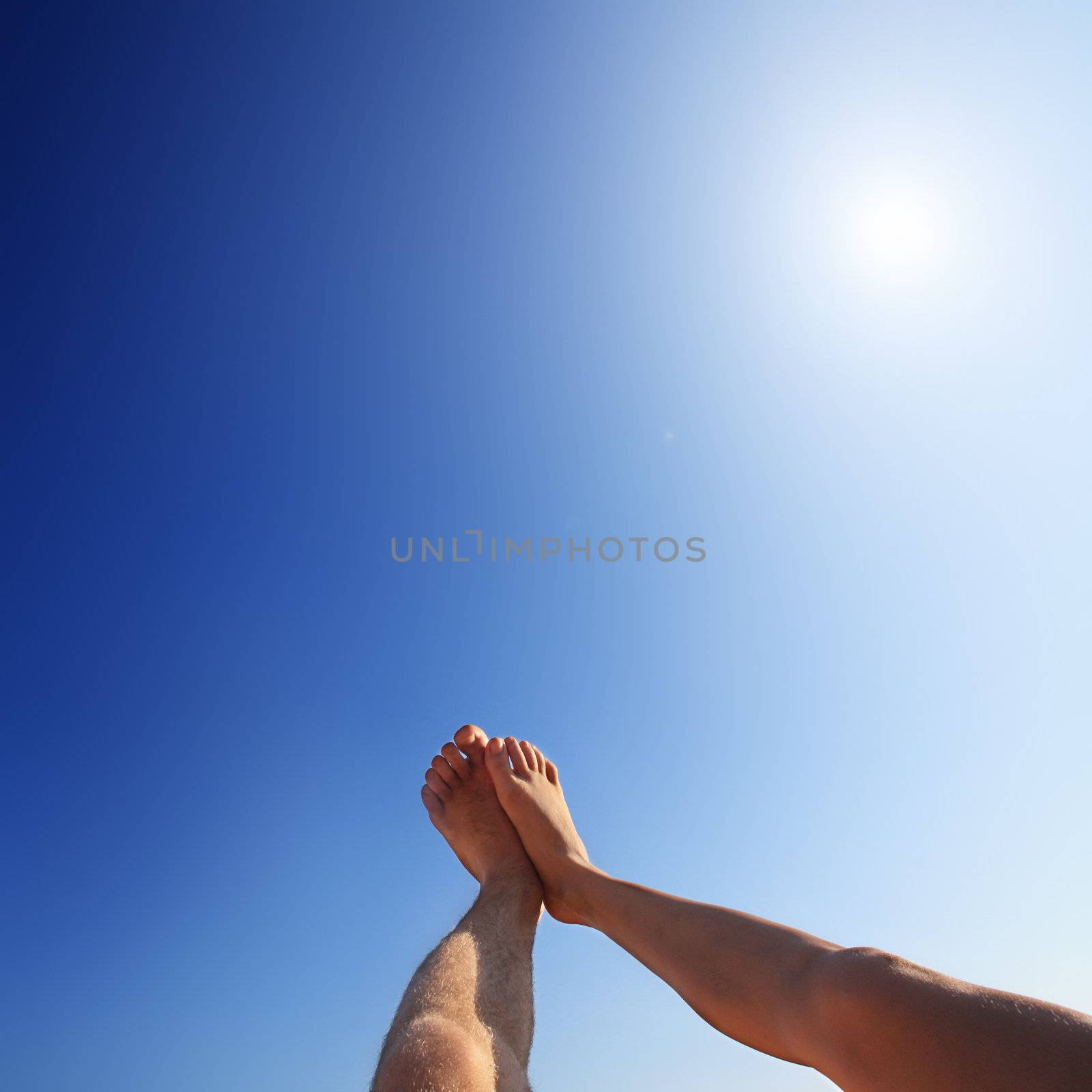 the sun shines on feet by photochecker
