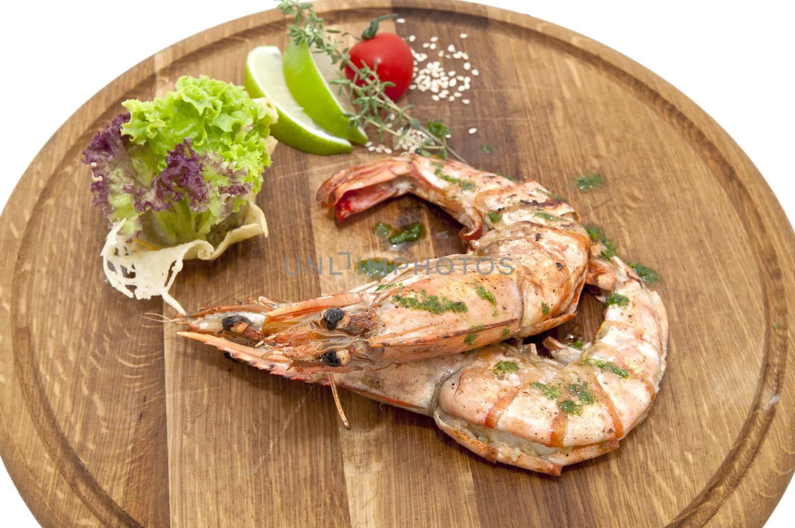Grilled Shrimp with Orange on a wooden plate