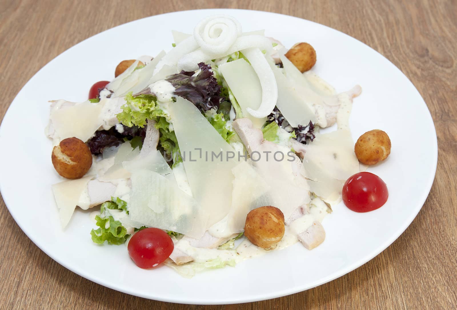 salad with vegetables, meat and cheese