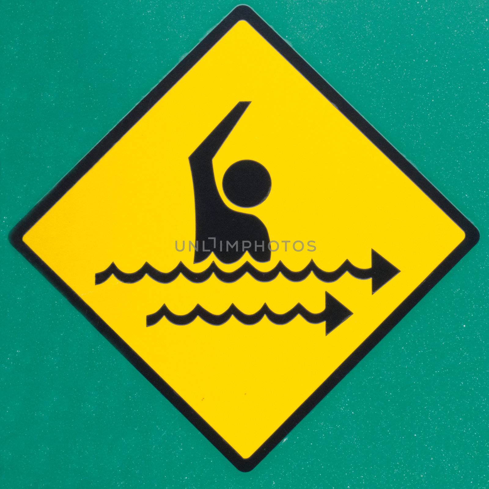 Rip current hazard symbol warning sign on green by PiLens