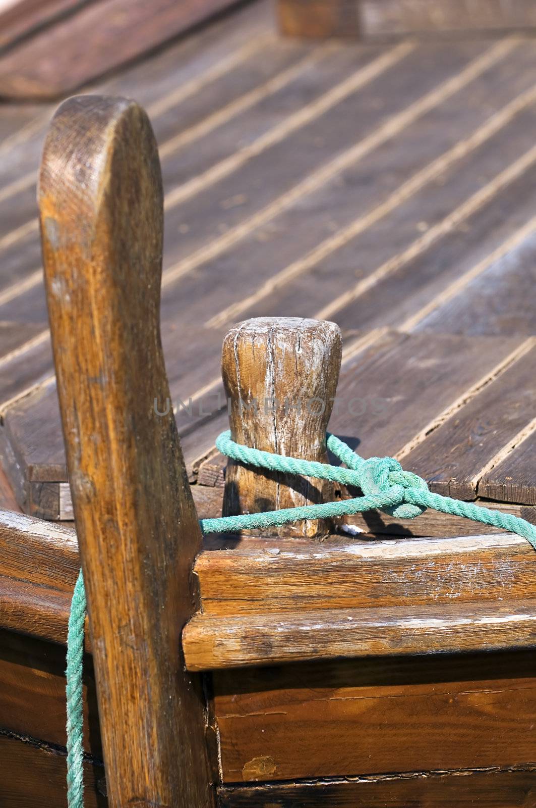 Detail of rope securing a wooden boat 