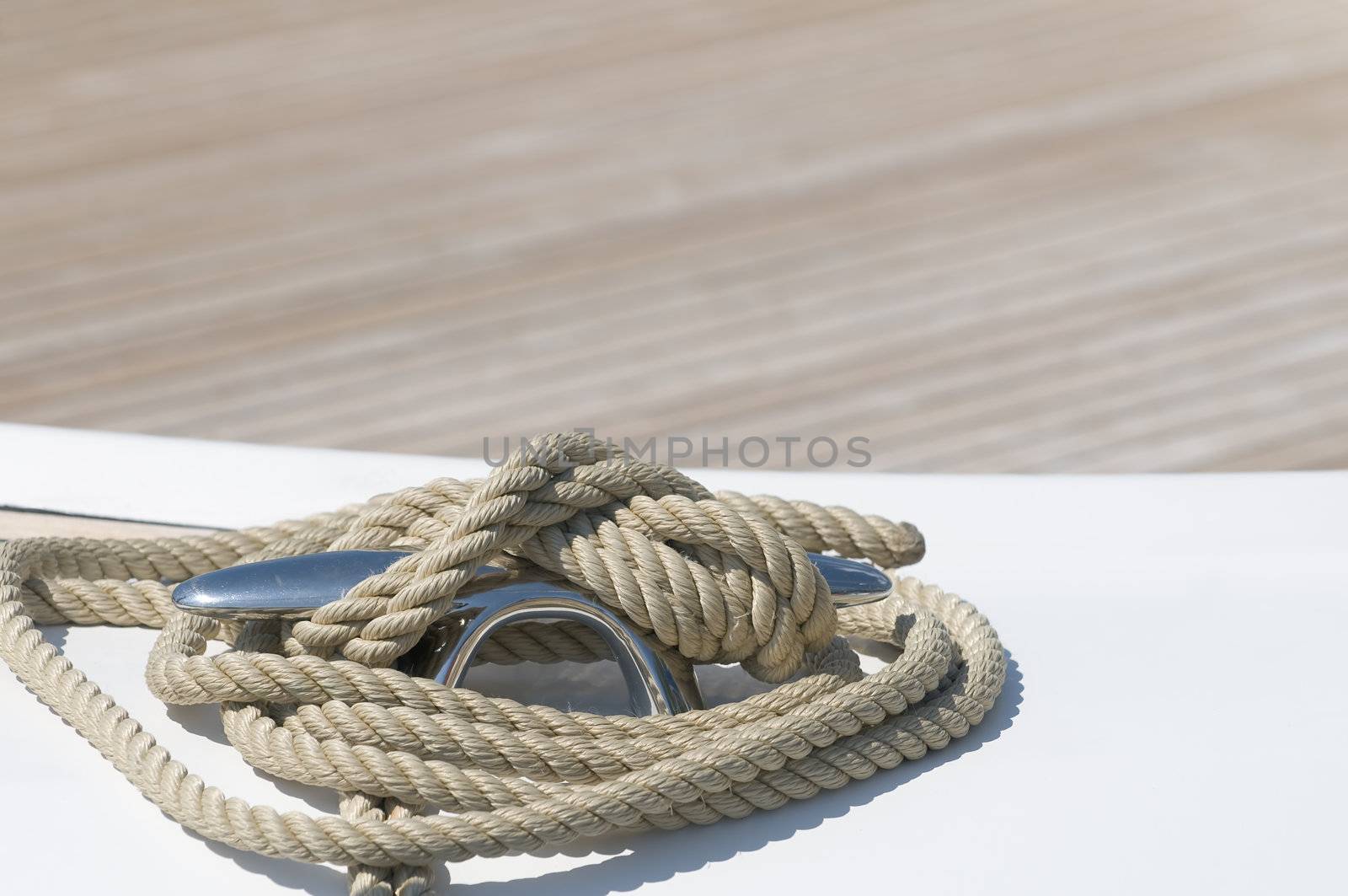 Close-up of rope tied-up on a boat bollard