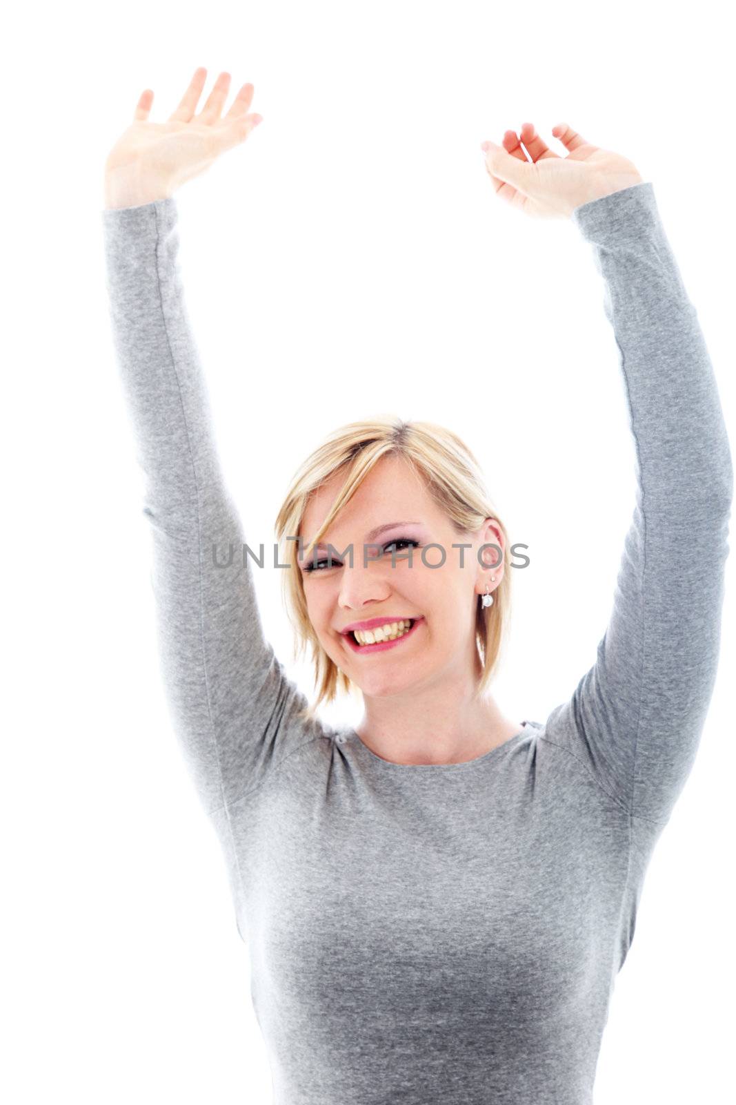 Successful beautiful young woman beaming with pleasure raising her arms above her head in exultation Successful beautiful young woman beaming with pleasure raising her arms abive her head in exultation 