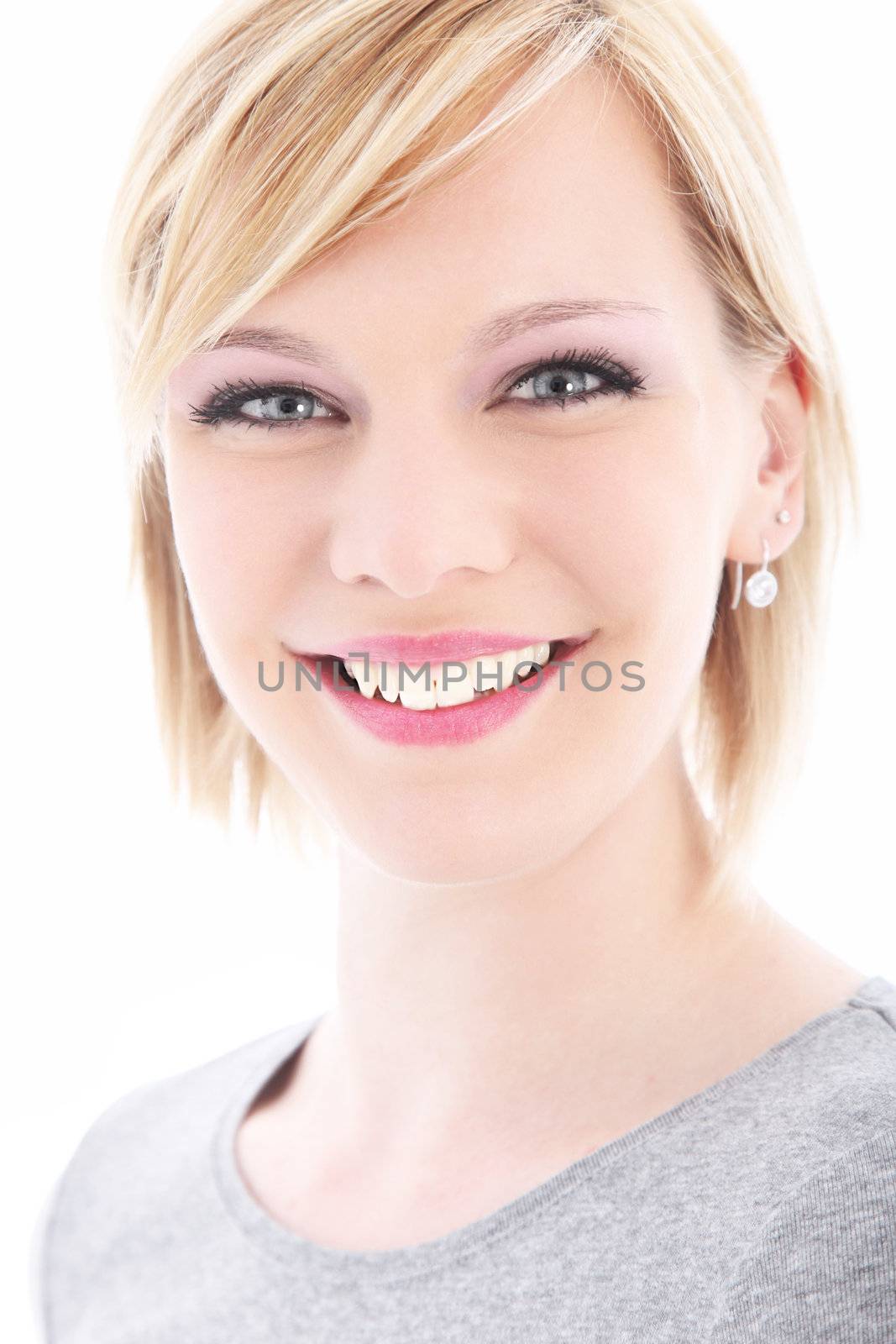 High key portrait of a beautiful blonde woman with a lovely wide smile and laughing eyes isolated on white High key portrait of a beautiful blonde woman with a lovely wide smile and luminous eyes isolated on white 
