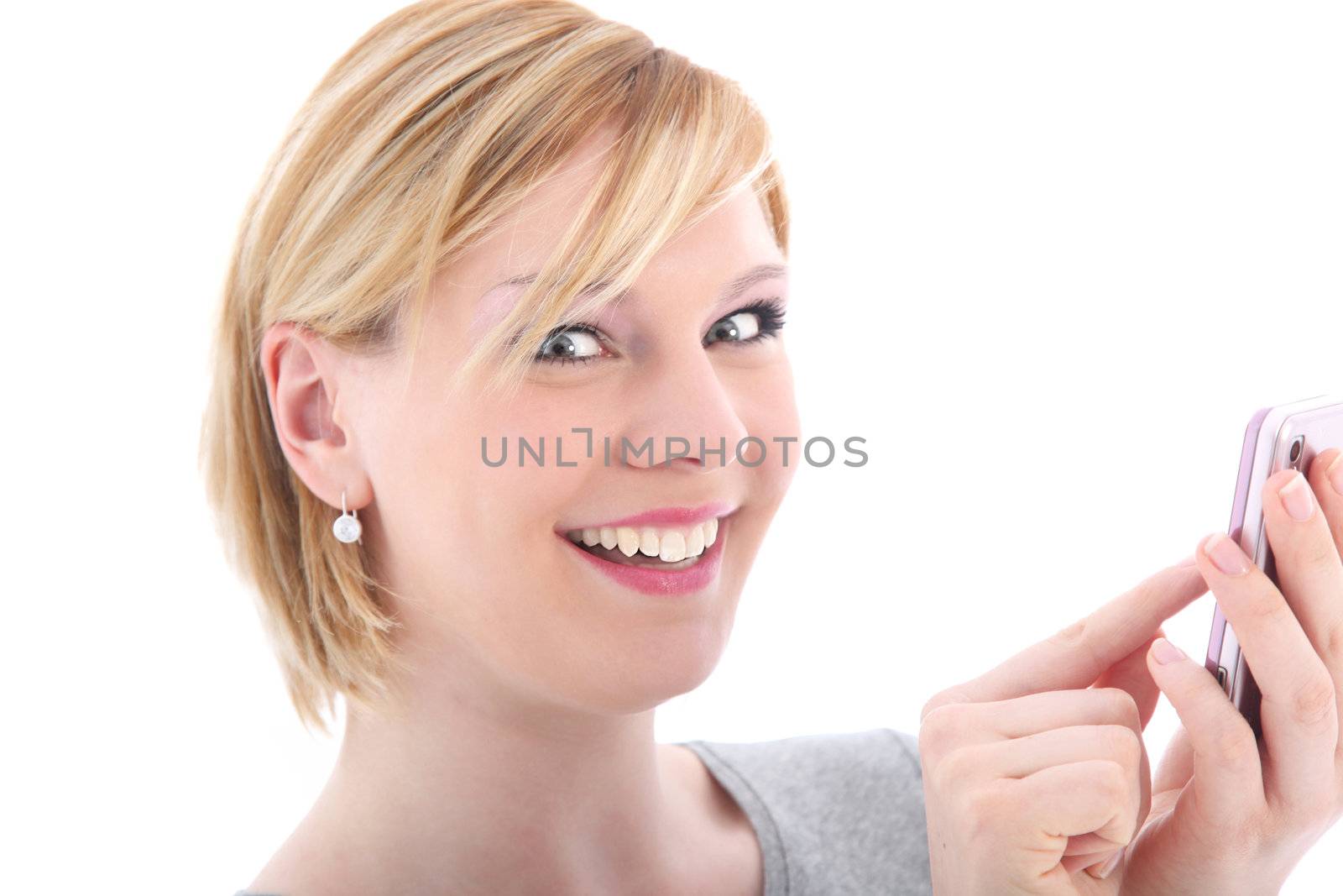 Excited woman texting with her finger on her touch screen mobile phone isolated on white 