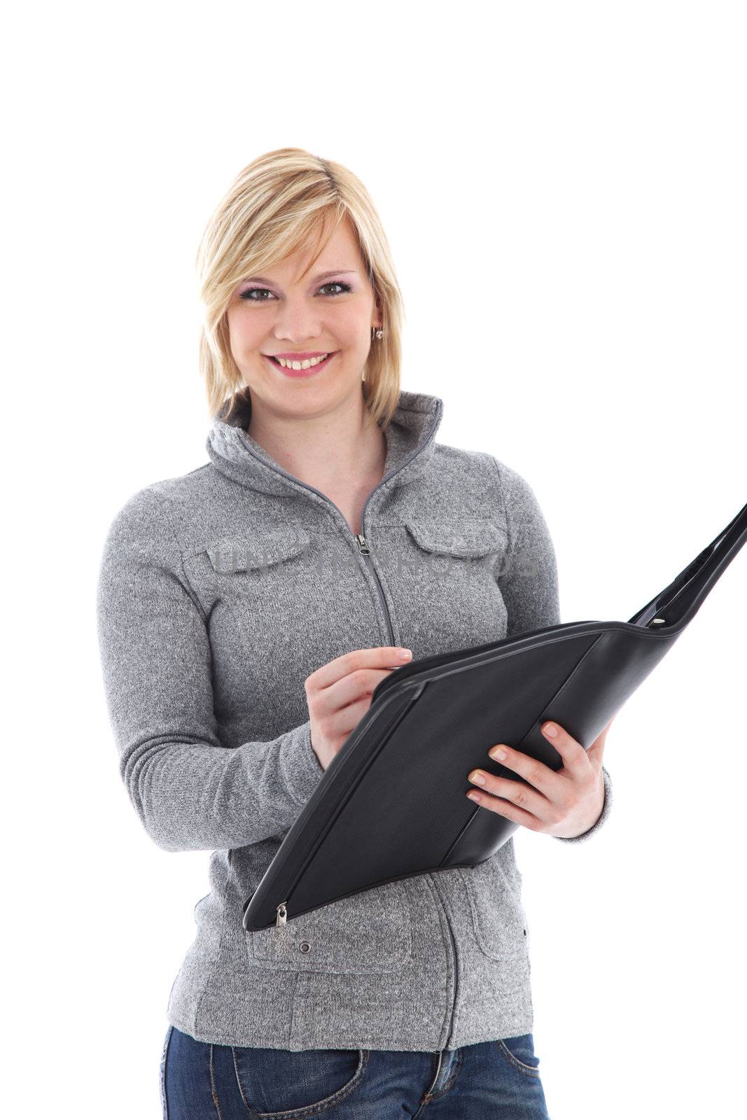 Smiling casual young female businesswoman or entrepreneur standing writing in a large handheld black folder isolated on white Smiling casual young lady standing writing in a large handheld black folder isolated on white 