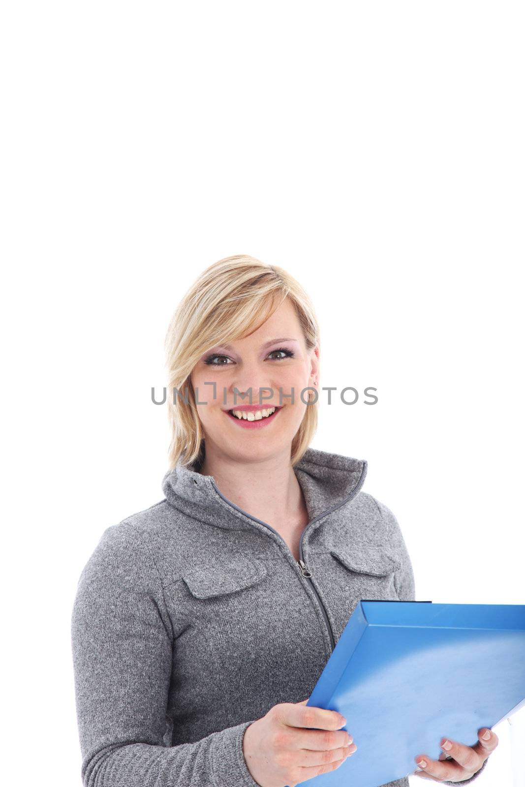 Smiling young blonde office worker standing with a blue folder in her hands isolated on white 