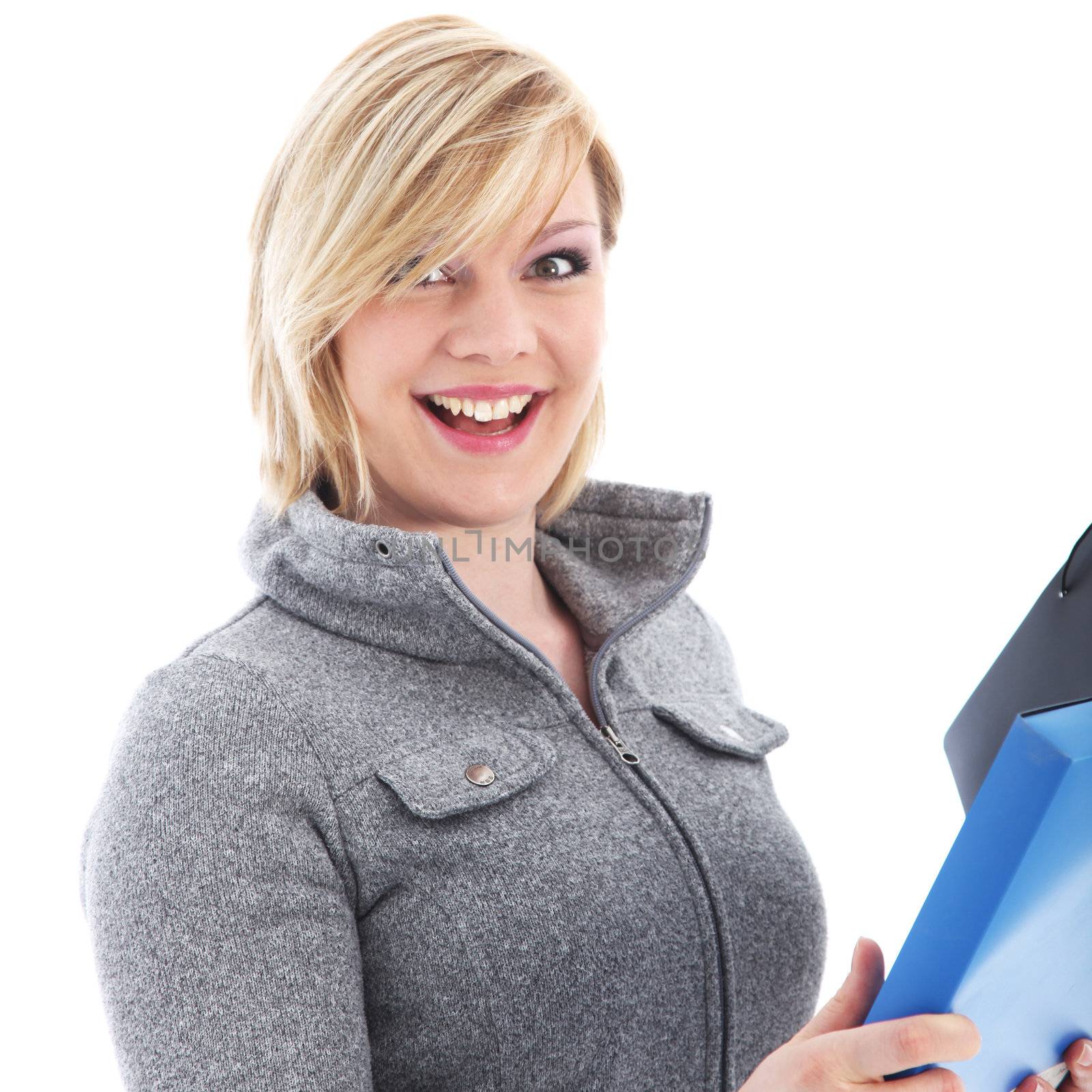 Vivacious young blonde office worker with a lovely broad smile and animated look holding a file isolated on white