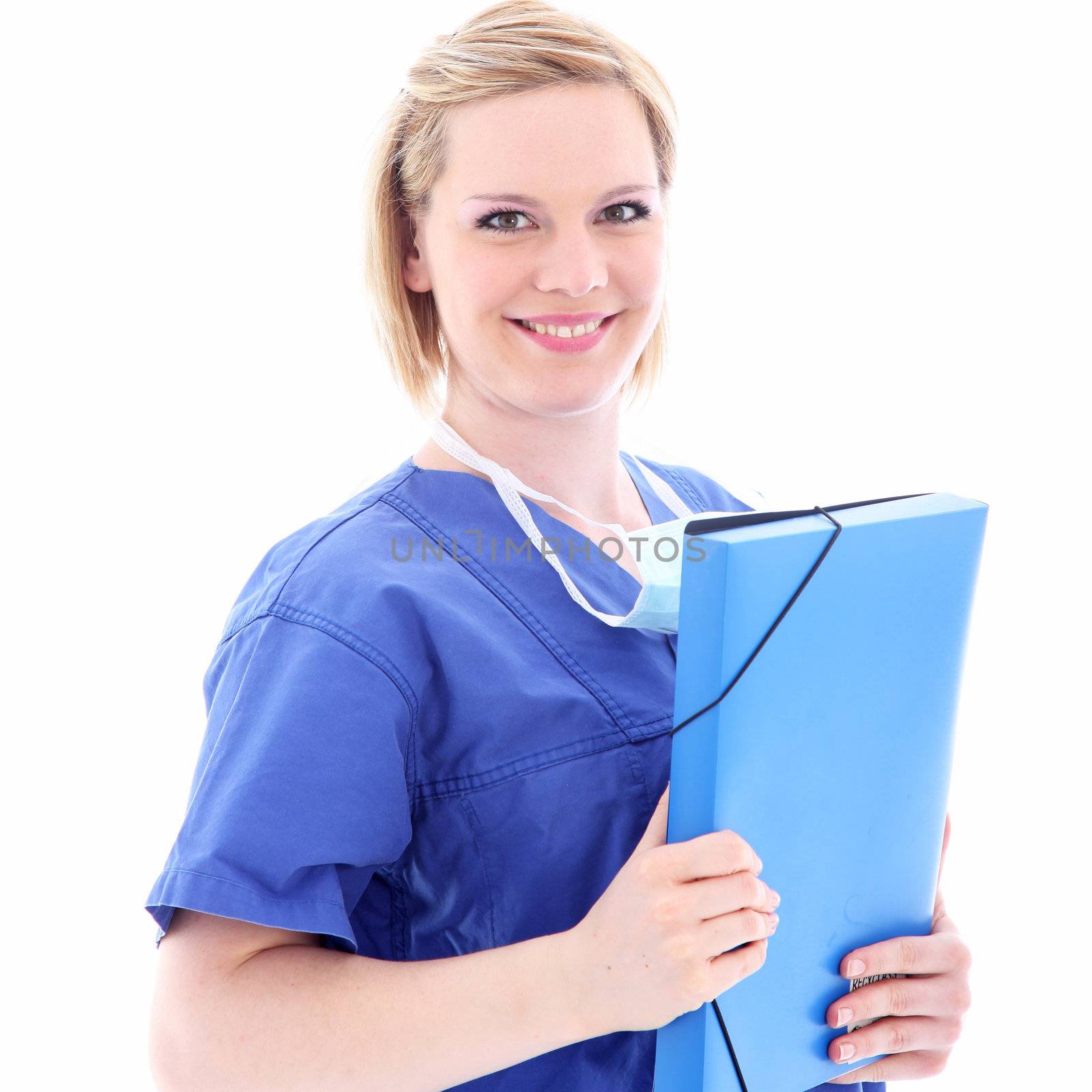 Friendly smiling nurse in blue scrubs holding a patient folder with information and records in her hands 