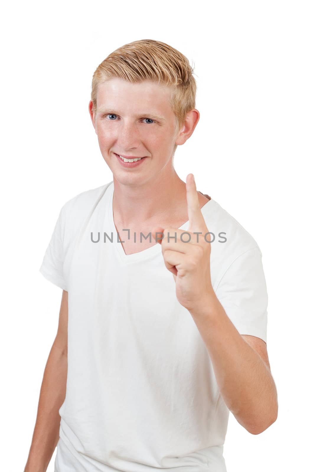 Portrait of a handsome young man pointing finger up against white background