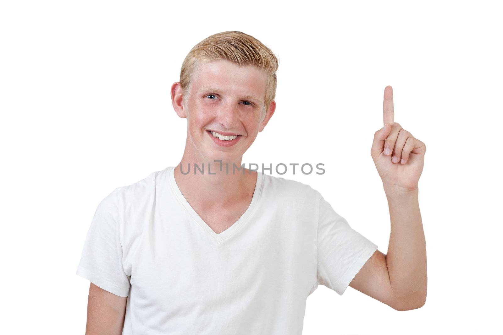 Portrait of a handsome young man pointing finger up against white background