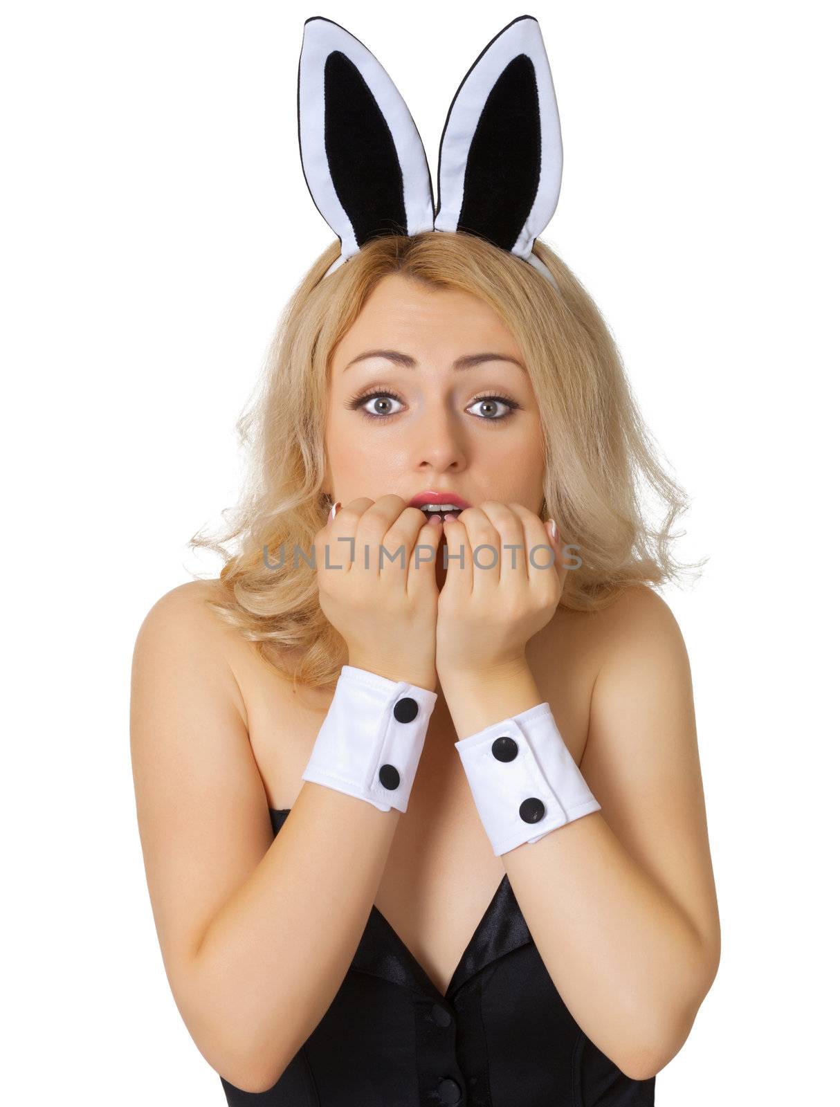 The frightened young girl dressed as a rabbit isolated on white background