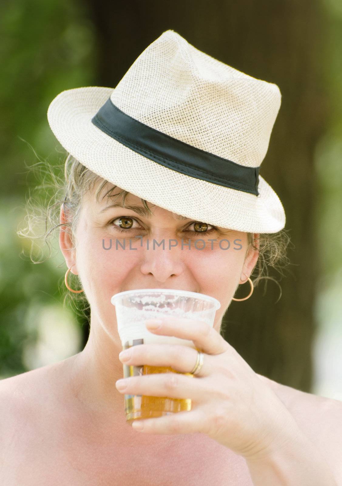 Woman surprised while drinking beer