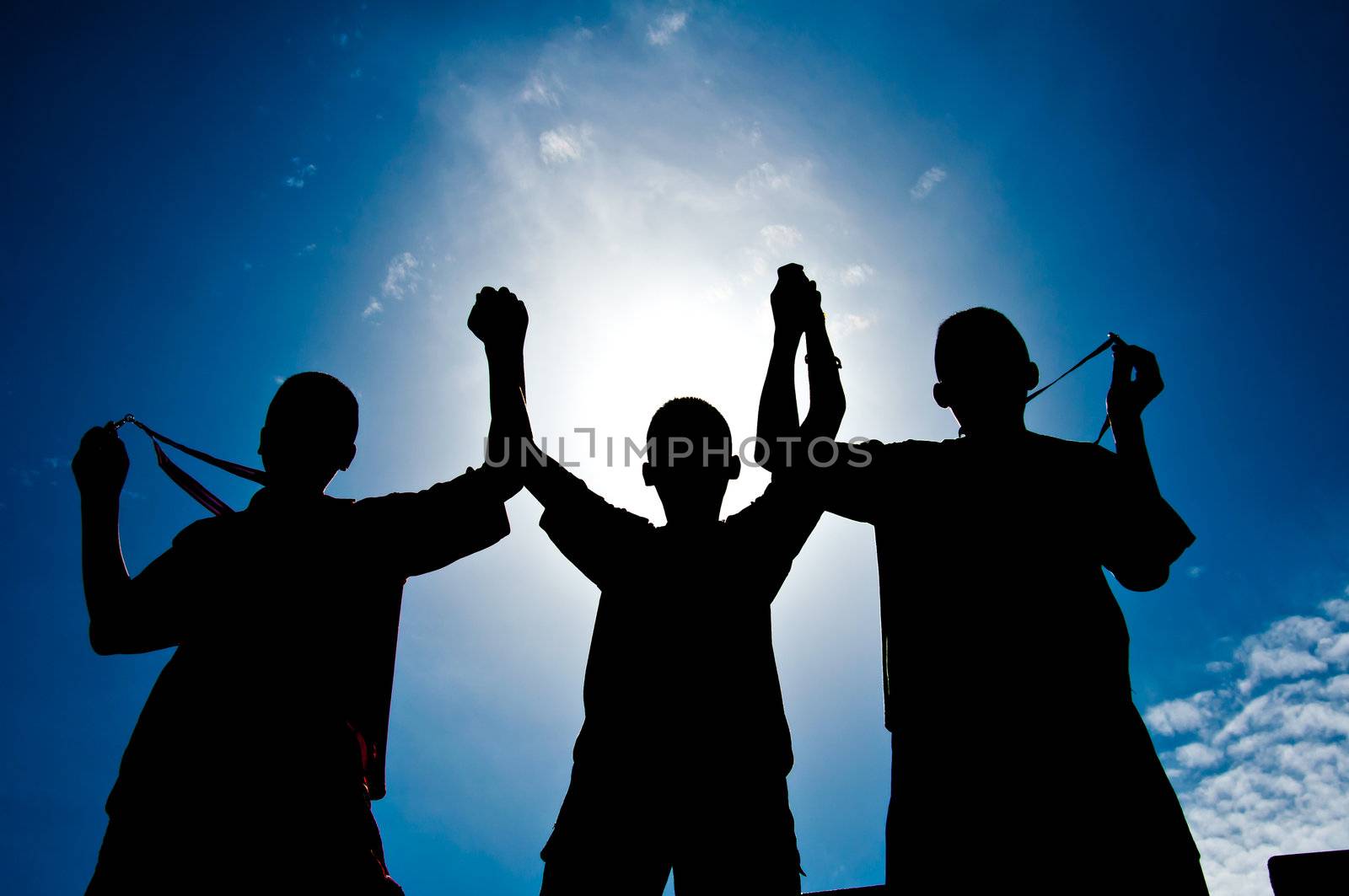 silhouette of boy with medal prize