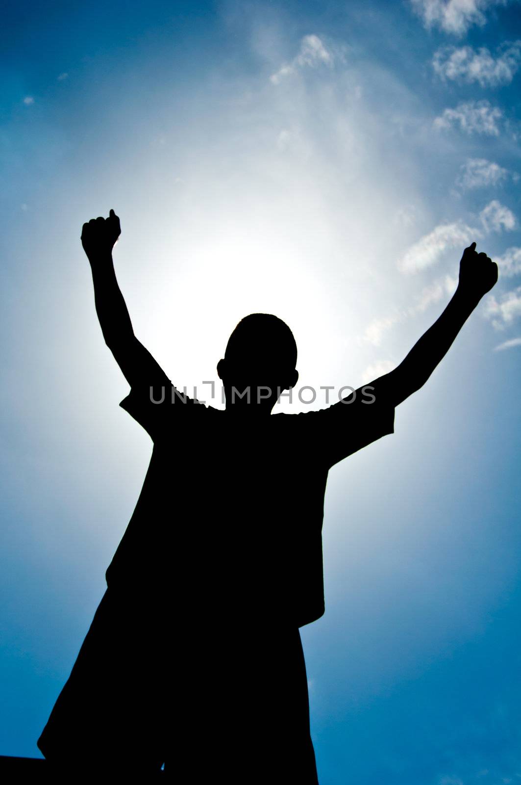 silhouette of boy with medal prize