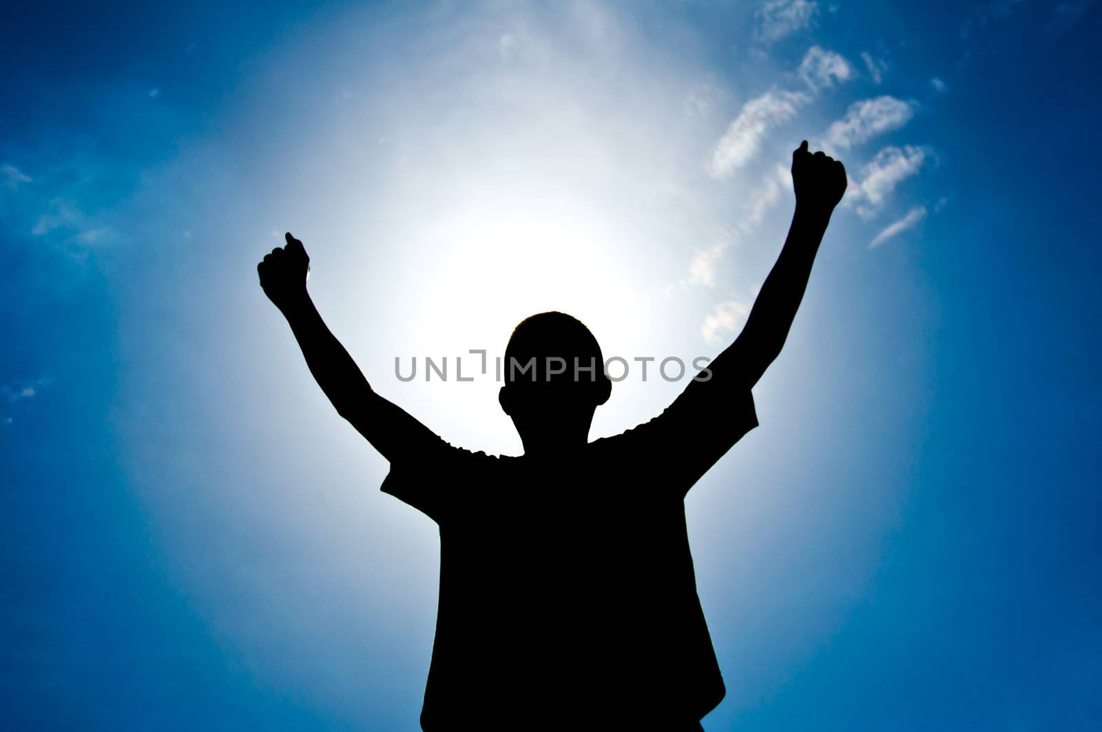 silhouette of boy with medal prize