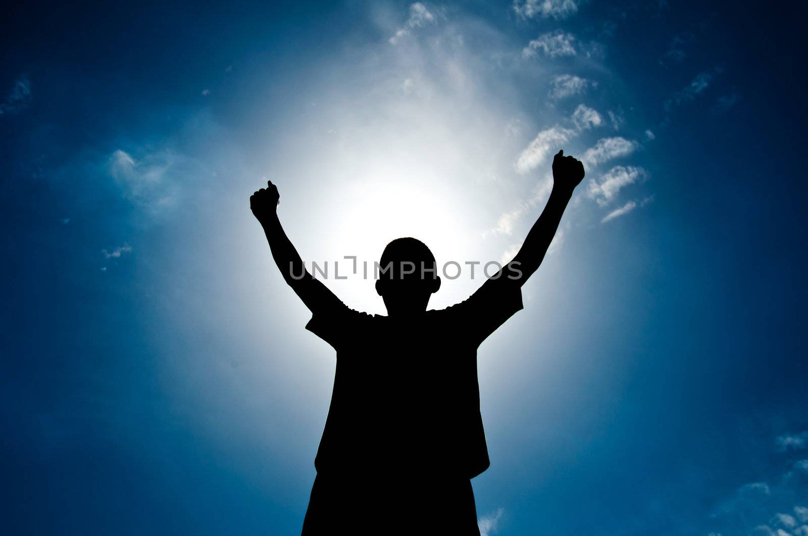 silhouette of boy with medal prize