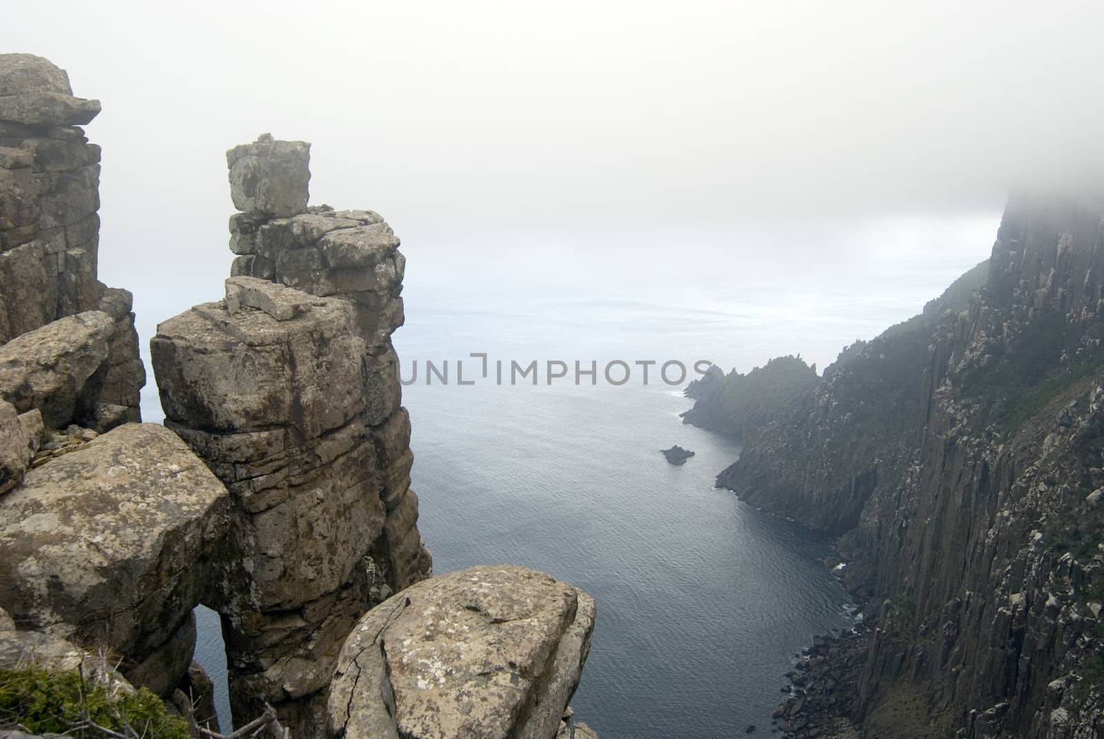 Precarious stacks of dolerite form the rugged cliffs of Cape Pillar, Tasmania