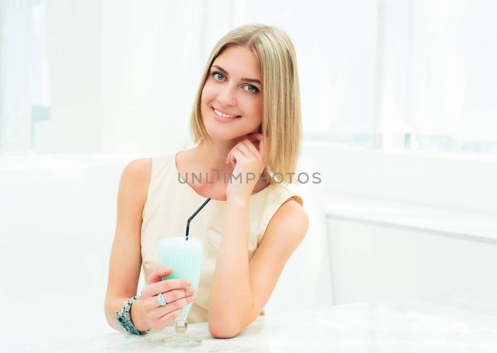 Portrait of a cute woman in urban cafe. bright colors, urban lifestyle