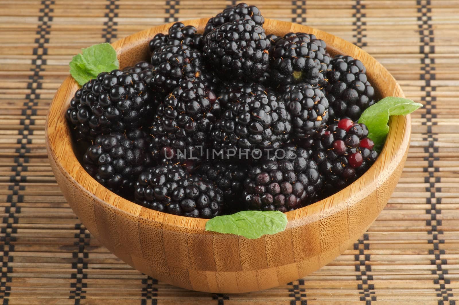 Blackberries in Wooden Bowl by zhekos