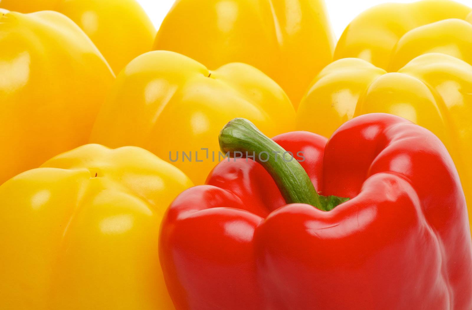 Background of One Red and Some Yellow Bell Peppers close up