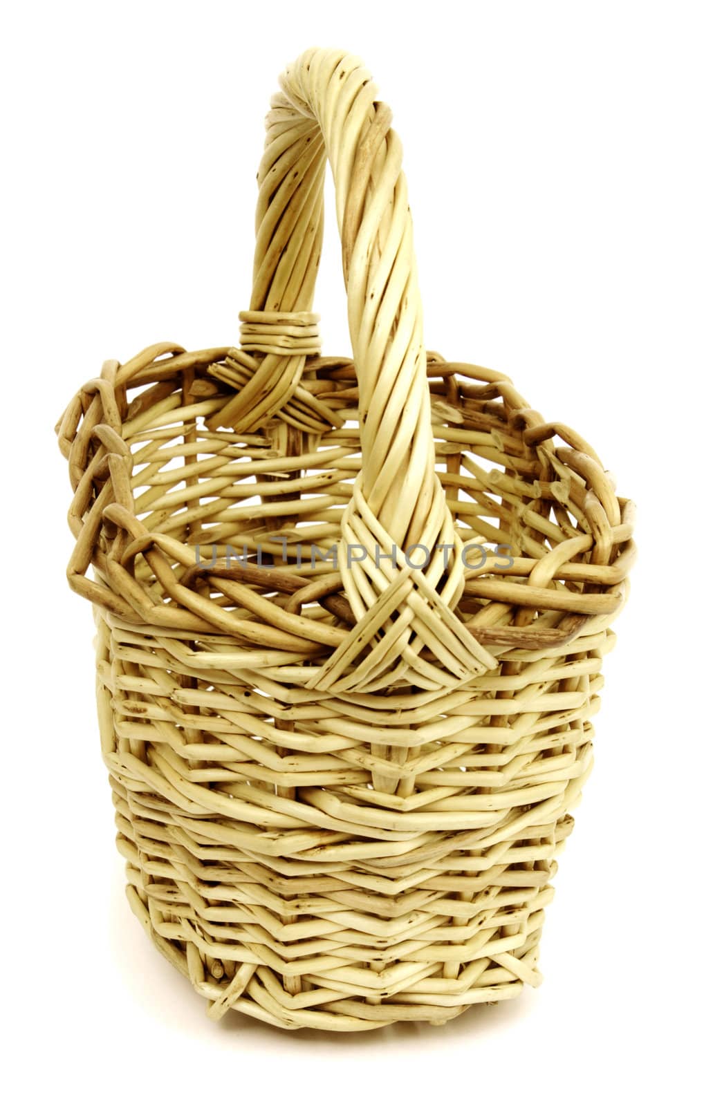 Basket in wattled from willow rods in white background