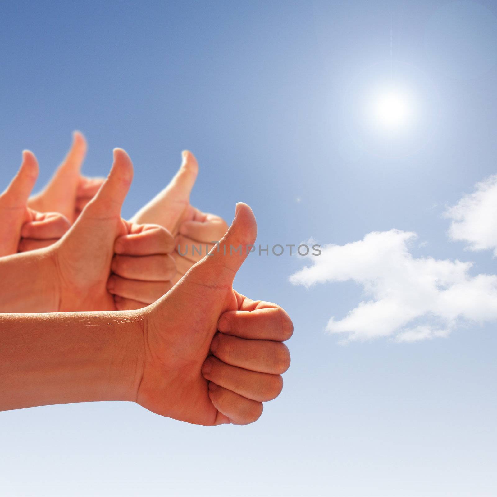 thumbs up on background of blue sky and white clouds by photochecker