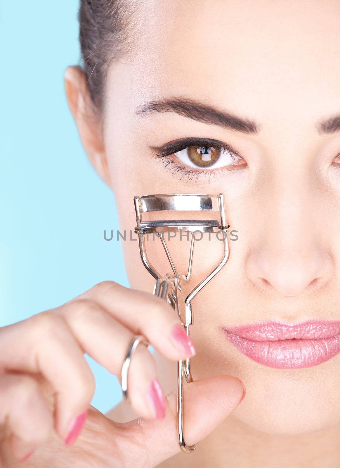 woman holding tool for eyelash by imarin