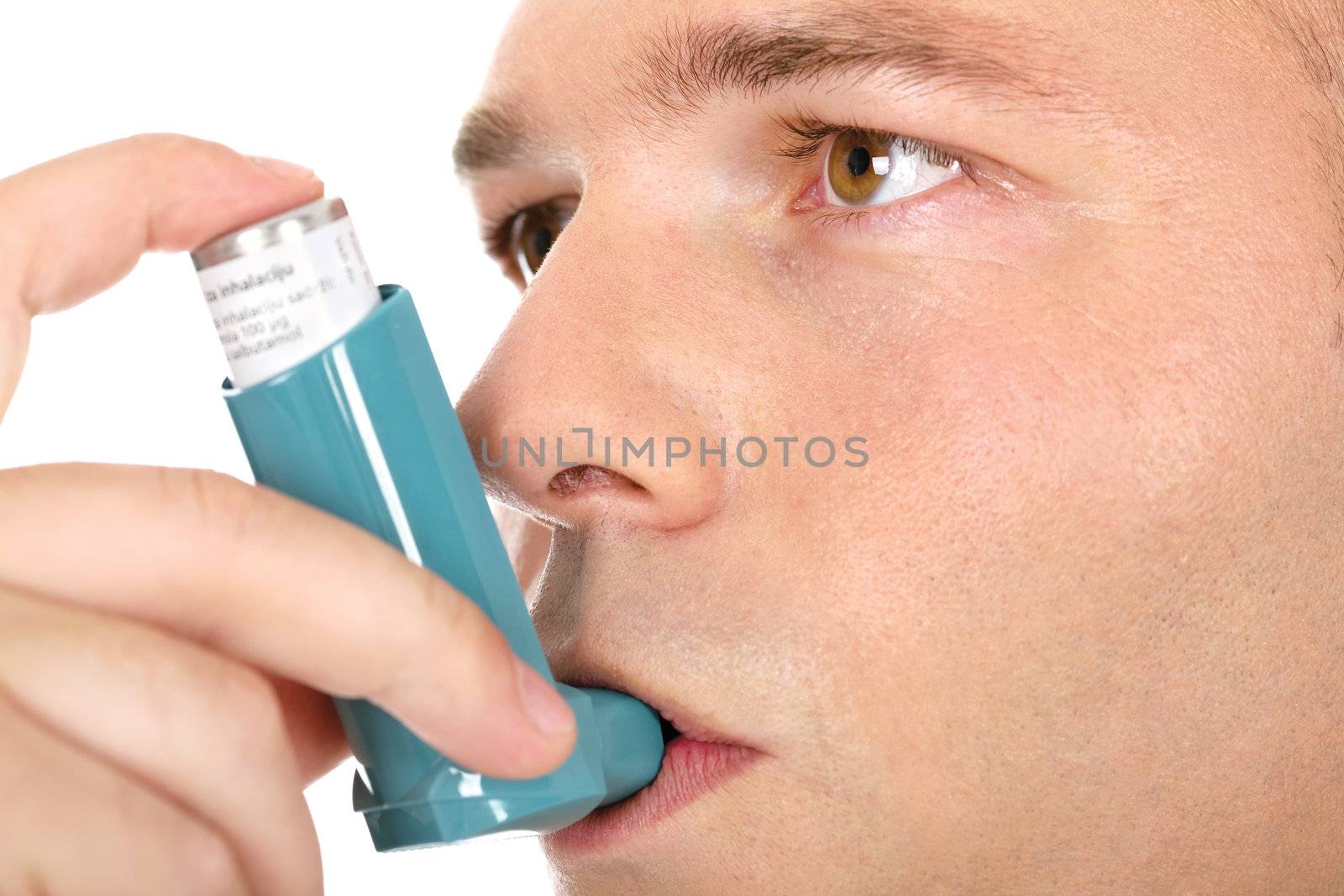 Close up look of a man with pump in his mouth, against asthma by imarin