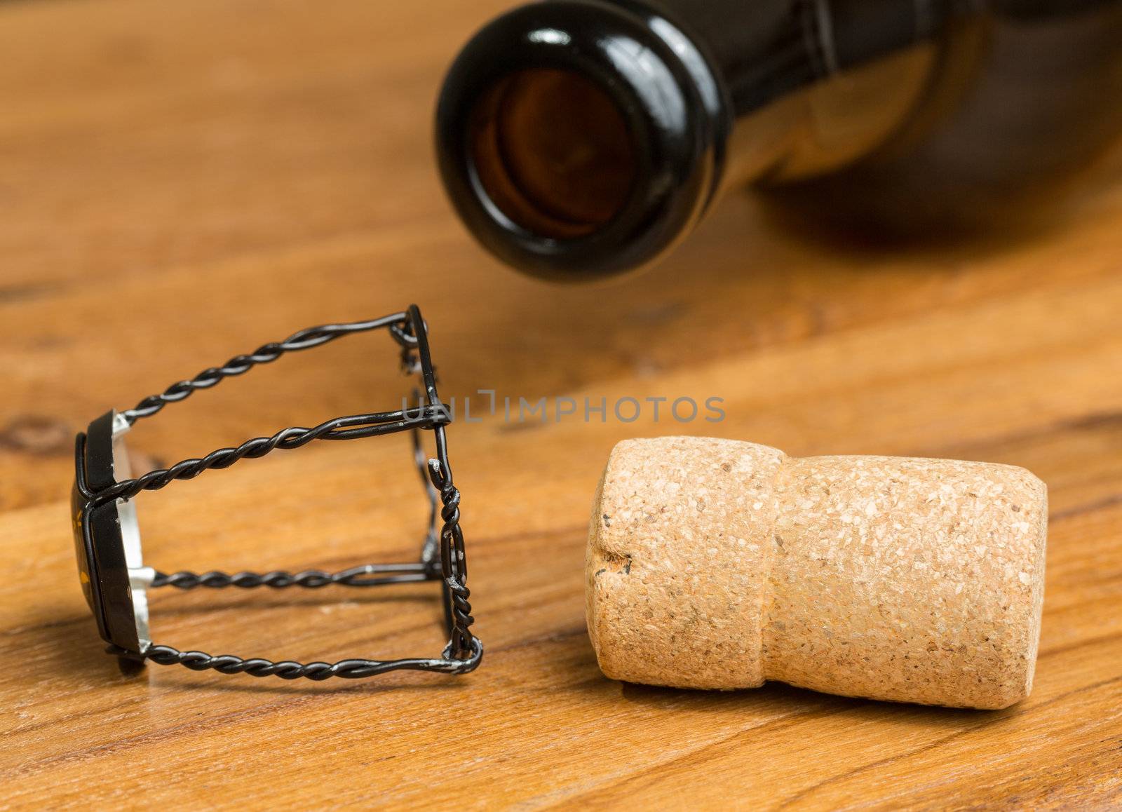 Champagne style cork and retaining cap by brown bottle of strong belgium ale beer