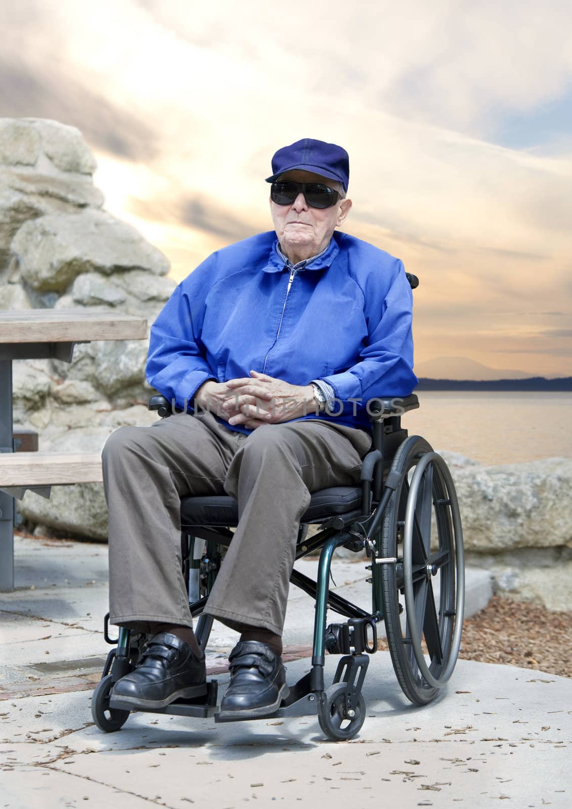 Elderly senior man in wheelchair sitting outside by jarenwicklund