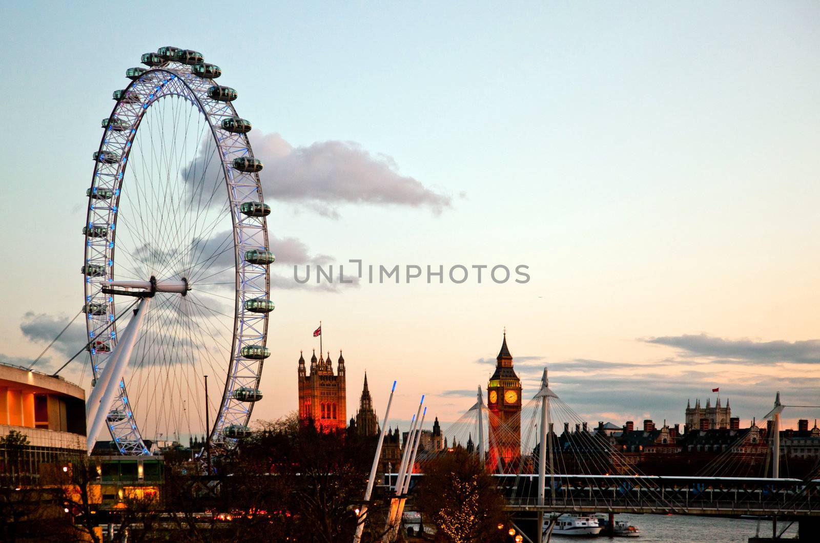 LONDON - April 15: London Eye with Big ben, on April 15, 2012 in London. The largest Ferris wheel in Europe, structure of the London Eye is 135 M. tall and the wheel has a diameter of 120 M.