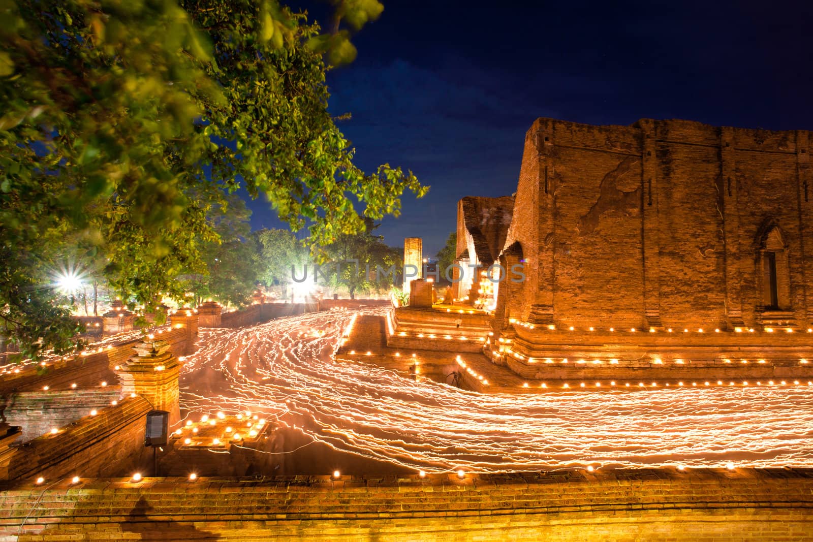 candle light trail of Buddhism Ceremony at temple ruin on Asalha Puja day