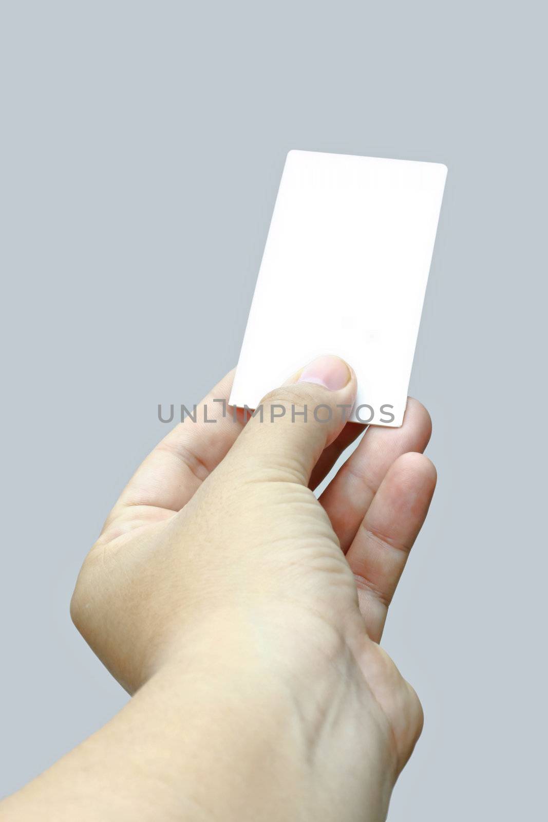 Hand holding and showing a blank business card.