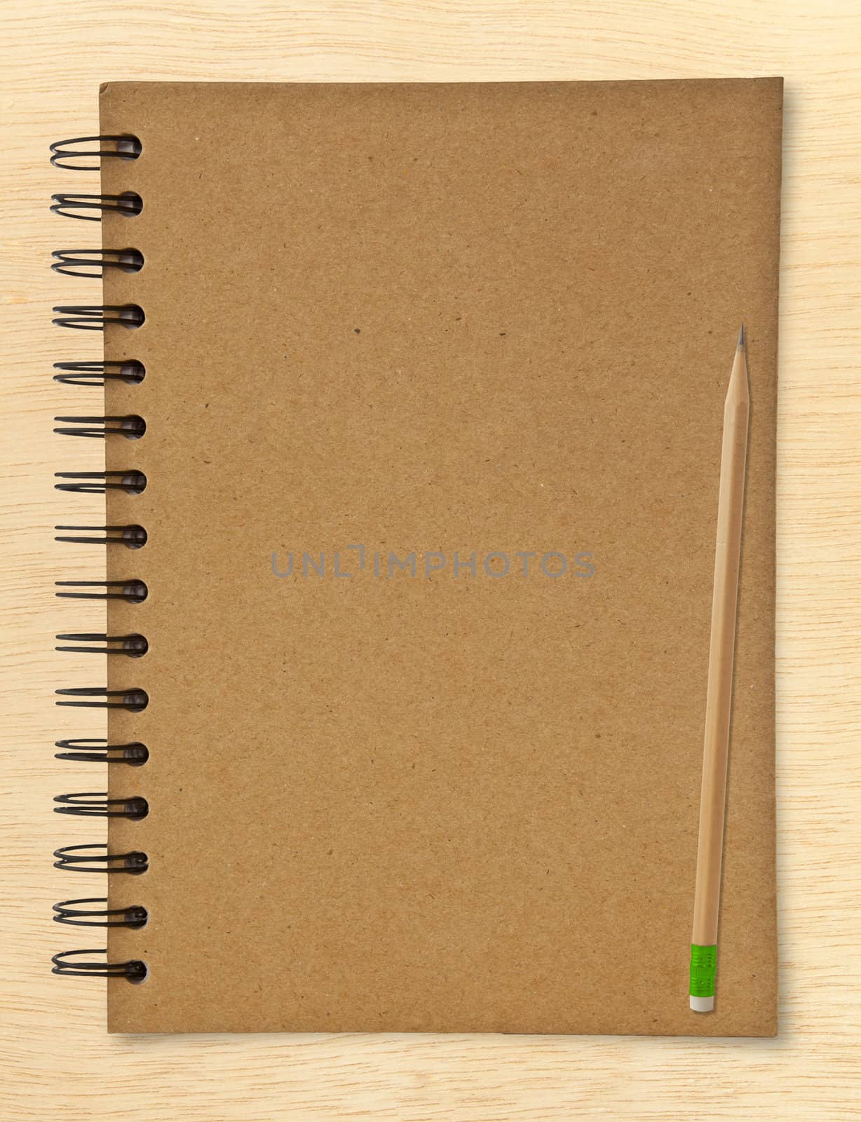 recycle notebook and wooden pencil on wood background
