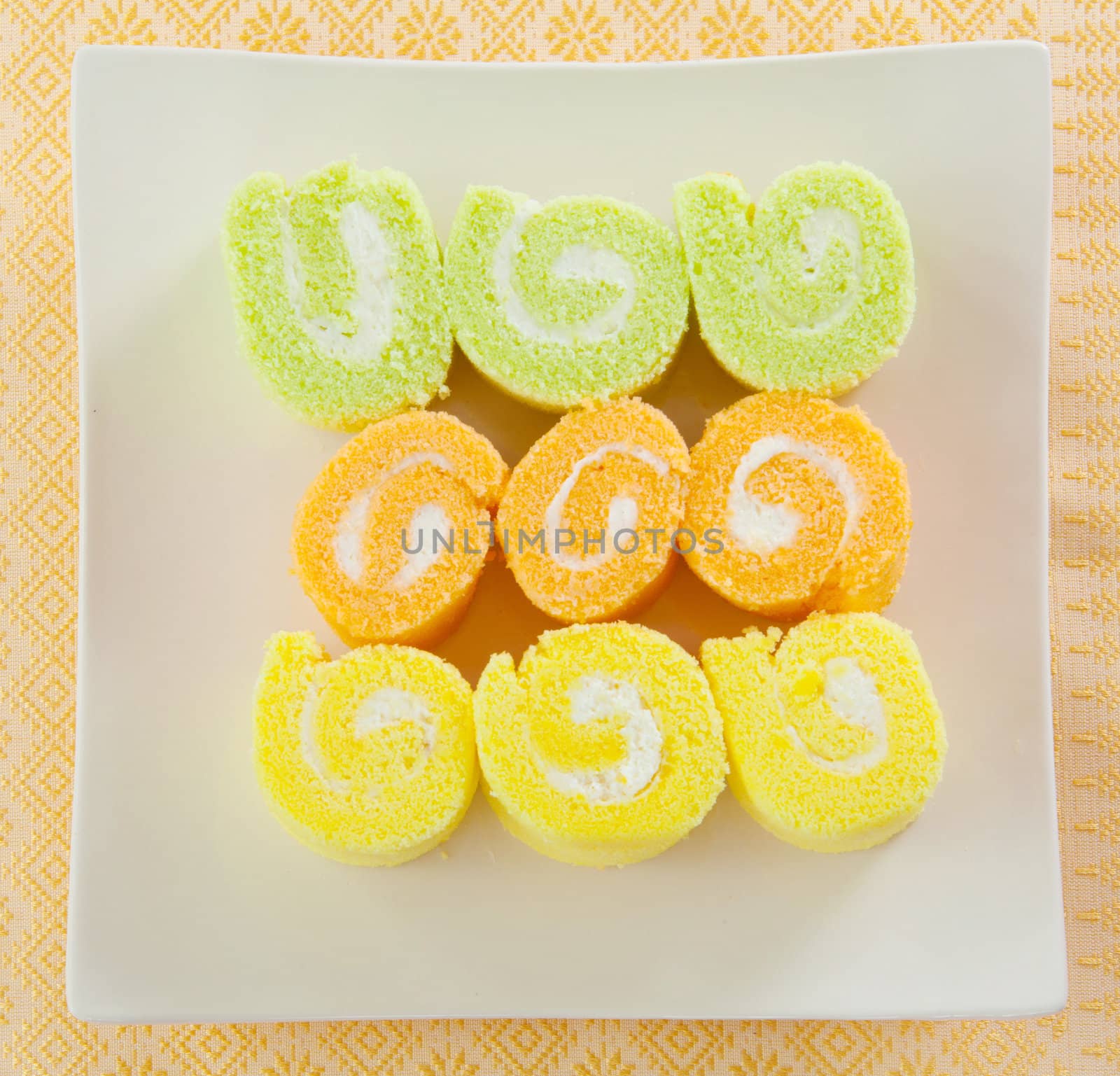 roll cake for dessert simply and freshness on orange background