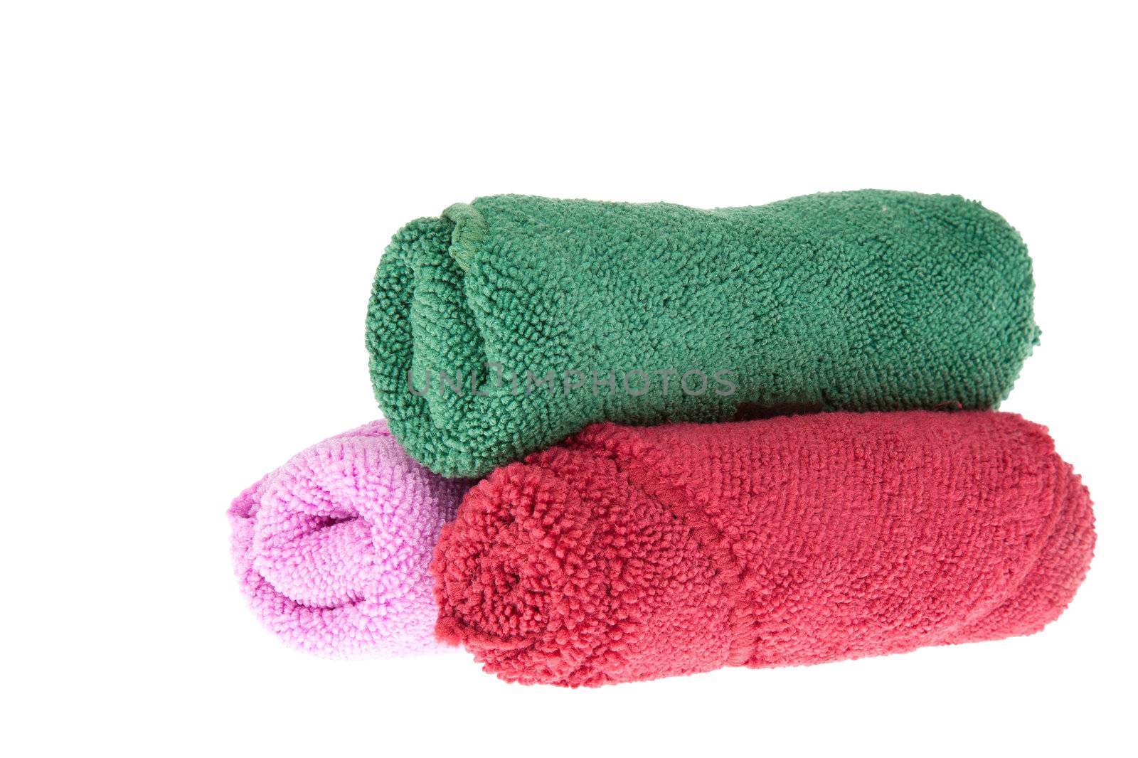 colorful towels rolls on white background