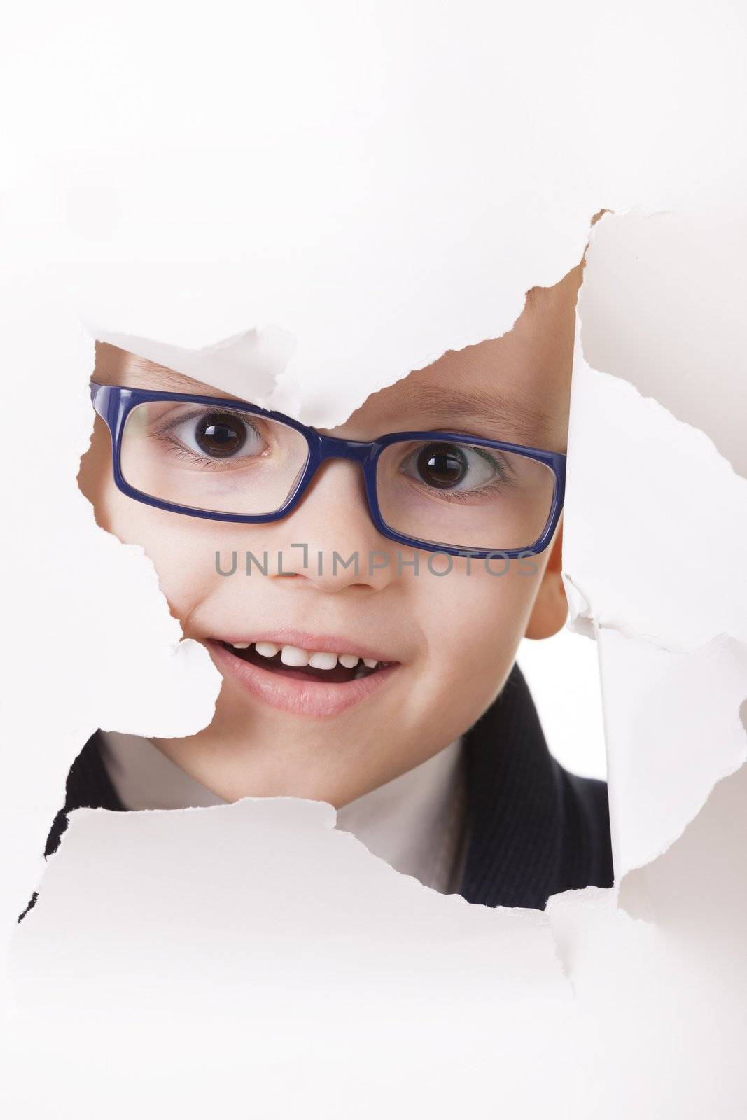 Curious kid looks through a hole in paper by iryna_rasko