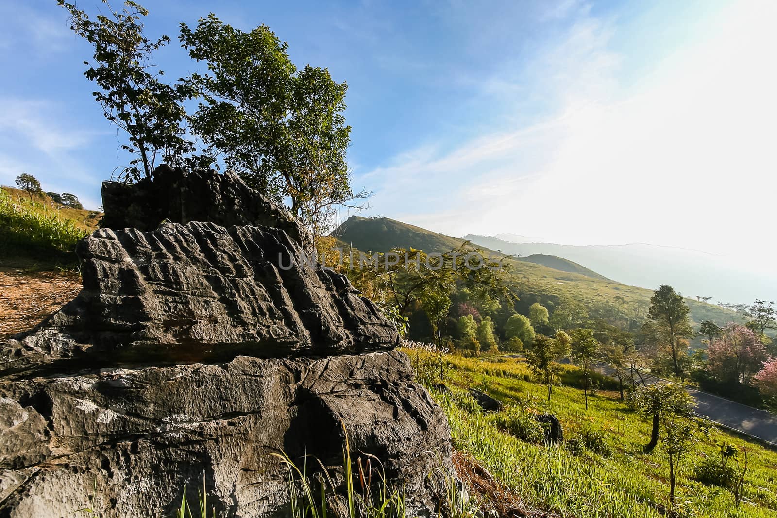 Stone on mountain with cloudy blue sky