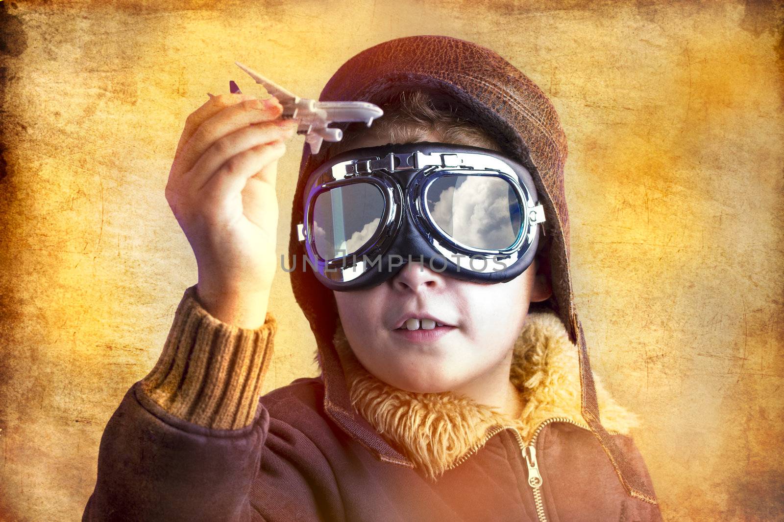 artistic portrait of child with former flight suit, with hat and sunglasses