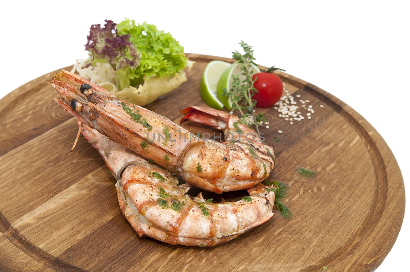 Grilled Shrimp with Orange on a wooden plate